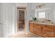 Bathroom featuring a glass enclosed shower, single sink vanity and a tiled floor at 2464 Chatham Dr, Indian Land, SC 29707