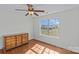 Bedroom featuring a dresser, hardwood floors and a large window with natural light at 2464 Chatham Dr, Indian Land, SC 29707