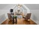 Bright bonus room with hardwood floors, vaulted ceilings, and comfortable seating arrangement at 2464 Chatham Dr, Indian Land, SC 29707