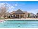 Inviting community pool with a covered lounge area, perfect for relaxation and socializing at 2464 Chatham Dr, Indian Land, SC 29707