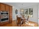 Dining area with hardwood floors, a round table, and a large window for natural light at 2464 Chatham Dr, Indian Land, SC 29707