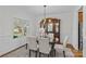 Elegant dining room with natural light, stylish decor, and a beautiful glass table set at 2464 Chatham Dr, Indian Land, SC 29707