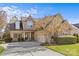Charming stone and brick home featuring a well-manicured lawn and an attached two-car garage at 2464 Chatham Dr, Indian Land, SC 29707