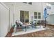 Relaxing back patio featuring patio seating set, a small area rug, and an umbrella for shade at 296 Laura Elizabeth Ln, Clover, SC 29710