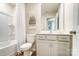 Clean bathroom with a shower-tub, a white vanity, a toilet and elegant wall art at 296 Laura Elizabeth Ln, Clover, SC 29710