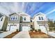 Charming townhomes feature a modern design with individual garages and well-manicured landscaping at 296 Laura Elizabeth Ln, Clover, SC 29710