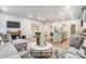 Open-concept living space with seamless flow from living room to dining area and kitchen island at 296 Laura Elizabeth Ln, Clover, SC 29710