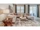 Modern living area with a neutral color palette, plush seating, and access to outdoor patio at 296 Laura Elizabeth Ln, Clover, SC 29710