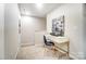 Bright office space with white desk and a navy blue chair, perfect for a home office or study area at 296 Laura Elizabeth Ln, Clover, SC 29710