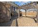 Beautiful outdoor stone patio with a grill and wooden pergola, perfect for entertaining or relaxing at 3907 Reid Cir, Sherrills Ford, NC 28673