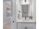 Bathroom featuring quartz countertop and decorative mirror at 3924 13Th Ne St, Hickory, NC 28601