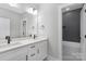 Modern bathroom with double vanity and tiled tub at 3924 13Th Ne St, Hickory, NC 28601
