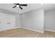 This bedroom features neutral walls, a ceiling fan, and a closet for storage at 3924 13Th Ne St, Hickory, NC 28601