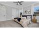 Bedroom with neutral walls, carpet, large windows, and stylish furniture at 3924 13Th Ne St, Hickory, NC 28601