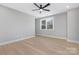 Sunlit empty room featuring hardwood floors, a window, and neutral wall paint at 3924 13Th Ne St, Hickory, NC 28601