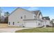 Side view of home featuring attached two car garage and well-kept lawn at 3924 13Th Ne St, Hickory, NC 28601