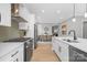 Modern kitchen with stainless steel appliances, white cabinets, and hardwood floors at 3924 13Th Ne St, Hickory, NC 28601