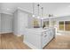 Bright kitchen island, featuring modern design, hardwood floors, and open layout at 3924 13Th Ne St, Hickory, NC 28601