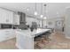 Bright, open kitchen with a large island, pendant lights, and seating for four at 3924 13Th Ne St, Hickory, NC 28601