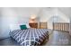 Cozy loft bedroom featuring a comfortable bed and modern decor under a charming angled ceiling at 416 E 18Th St, Charlotte, NC 28206