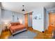 Cozy bedroom with a sliding barn door to a closet and decoratively staged furniture, perfect for relaxing at 416 E 18Th St, Charlotte, NC 28206