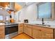 Beautiful kitchen with stainless steel appliances, wooden cabinets, granite countertops, and a subway tile backsplash at 416 E 18Th St, Charlotte, NC 28206