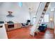 Open-concept living space boasting high ceilings, contemporary lighting, and a unique ladder leading to the loft at 416 E 18Th St, Charlotte, NC 28206