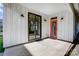 Covered patio with gray floor and white siding, sliding glass doors, and outdoor lighting at 416 E 18Th St, Charlotte, NC 28206