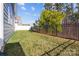 Well-maintained backyard featuring green grass and a black metal fence at 4288 Legacy Dr, Denver, NC 28037
