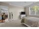 Cozy bedroom featuring plush carpeting, a full-length mirror and entertainment center at 4288 Legacy Dr, Denver, NC 28037
