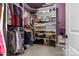 Organized walk-in closet with shelving and hanging storage at 4288 Legacy Dr, Denver, NC 28037