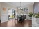 Bright dining room with black table and chairs, with chalk wall and sliding door to the patio at 4288 Legacy Dr, Denver, NC 28037