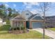 Beautiful home exterior with a stone facade, blue siding, and landscaped front yard at 4288 Legacy Dr, Denver, NC 28037