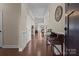 Inviting foyer with hardwood floors, elegant trim, and a view into the home's open layout at 4288 Legacy Dr, Denver, NC 28037