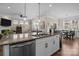 Open-concept kitchen featuring a large island with seating and stainless steel appliances, ideal for entertaining at 4288 Legacy Dr, Denver, NC 28037