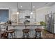 Kitchen featuring a large center island with bar seating, stainless steel appliances, and modern white cabinetry at 4288 Legacy Dr, Denver, NC 28037
