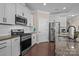 Kitchen featuring stainless steel appliances, granite countertops, and white cabinets at 4288 Legacy Dr, Denver, NC 28037