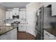 This kitchen features stainless steel appliances, granite countertops, and ample storage at 4288 Legacy Dr, Denver, NC 28037