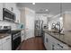Kitchen featuring stainless steel appliances, granite countertops, and white cabinets at 4288 Legacy Dr, Denver, NC 28037
