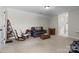 Spacious living room with neutral tones, ample seating, and carpet flooring at 4288 Legacy Dr, Denver, NC 28037