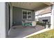 Covered patio with outdoor seating and grilling area, perfect for entertaining at 4288 Legacy Dr, Denver, NC 28037