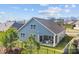 Rear of a two-story home with sliding doors that lead to the backyard patio at 4288 Legacy Dr, Denver, NC 28037