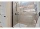 Modern shower with gray tiles, a glass door, and sleek fixtures at 4288 Legacy Dr, Denver, NC 28037
