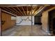 Unfinished basement with exposed ceiling and concrete walls and floors, offering potential at 4774 E Nc 150 Hwy, Lincolnton, NC 28092