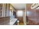 Bathroom with tiled walls, vanity sink, and a bathtub/shower combination at 4774 E Nc 150 Hwy, Lincolnton, NC 28092