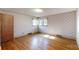 Bright bedroom with hardwood floors, decorative wallpaper, and natural light from the windows at 4774 E Nc 150 Hwy, Lincolnton, NC 28092