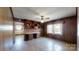 Cozy den with wood paneling, built-in shelving, and a ceiling fan at 4774 E Nc 150 Hwy, Lincolnton, NC 28092