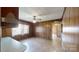 Den featuring wood paneling, ceiling fan and view to next room at 4774 E Nc 150 Hwy, Lincolnton, NC 28092