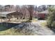 Driveway leading to a carport, with a section of the red brick home visible at 4774 E Nc 150 Hwy, Lincolnton, NC 28092