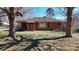 Traditional brick home featuring mature trees and a cozy front porch at 4774 E Nc 150 Hwy, Lincolnton, NC 28092